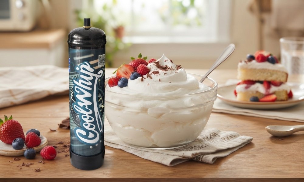 Glass bowl of fluffy whipped topping with strawberries, blueberries and chocolate shavings beside a berry sponge cake, Where to Buy Cool Whip